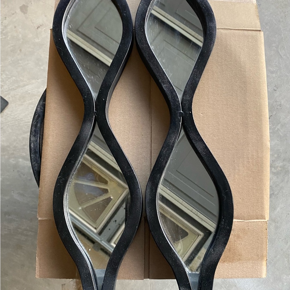 Black Wavy Wall Mirrors Sconce
20 1/4 inches long
4 1/2 inches wide